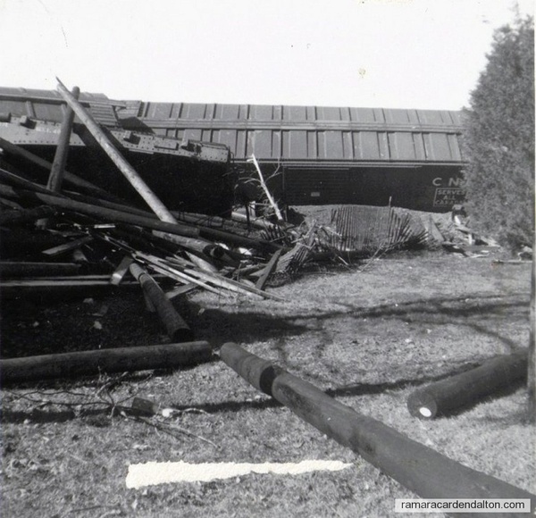 derailed boxcars and debris